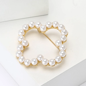 Elegant hollow flower brooch with white pearls and gold alloy base for women's fashion