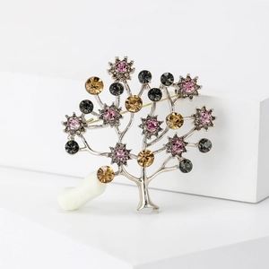 Elegant rhinestone tree-shaped alloy brooch with colorful sparkling crystals on white stand