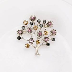 Sparkling rhinestone tree brooch with pink and champagne stones in silver setting