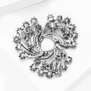 Detailed view of the vintage silver Christmas bell brooch with hollow petal back structure