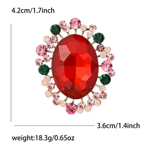 Detail view of retro oval red crystal brooch with pink and green rhinestones, 4.2x3.6cm