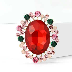 Exquisite crystal brooch with large red oval gemstone and colorful rhinestones in gold
