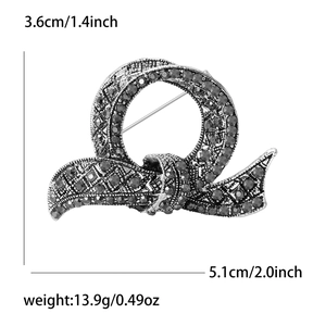 Luxury vintage silver alloy bow brooch with dark rhinestones and size measurements