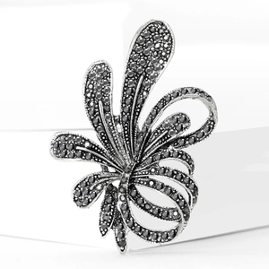 Close-up of luxury flower brooch with intricate silver alloy and black rhinestones