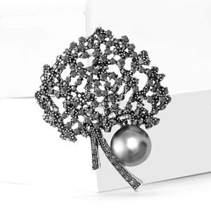 Vintage gunmetal tree brooch with dark pearls and shimmering grey crystals
