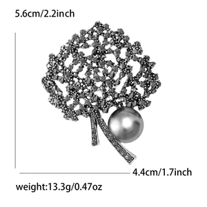 Vintage silver tree brooch with grey rhinestones and large pearl, measuring 5.6cm by 4.4cm
