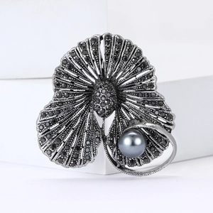 Broche vintage en alliage bronze noir avec strass noirs et grosse perle grise
