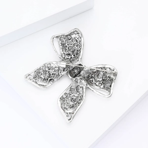 Detailed back view of a retro silver butterfly brooch showing the clasp and hollow craft
