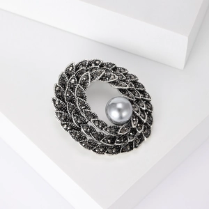 Vintage gunmetal floral wreath brooch featuring grey pearl and marcasite stones