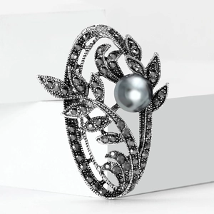 Vintage gunmetal silver brooch with floral pavé diamonds and a large grey center pearl