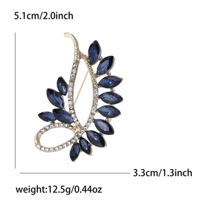 Vintage gold crystal feather brooch with blue gems and white rhinestones for women