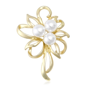 Matte gold floral brooch with elegant white pearls and a flowing tassel design