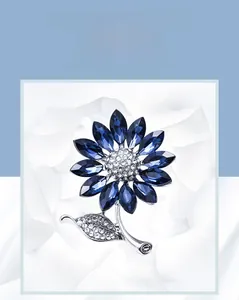Detail showing sunflower crystal brooch with navy blue petals and white zircon setting