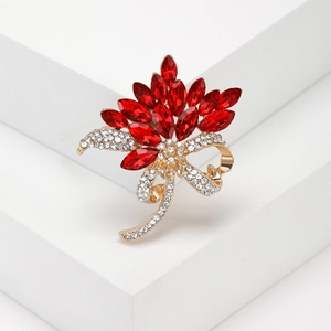 Elegant floral crystal brooch with red marquise stones and gold-plated rhinestone ribbon