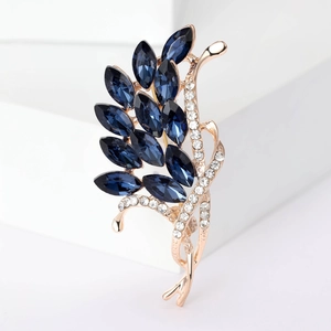 Elegant rose gold bouquet brooch with dark blue marquise crystals and white rhinestones