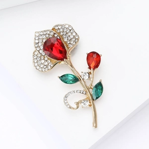 Detail of flower brooch with red pear-cut crystal and sparkling pavé rhinestones