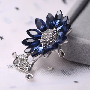 Elegant sunflower crystal brooch with deep blue water-drop stones and silver alloy base
