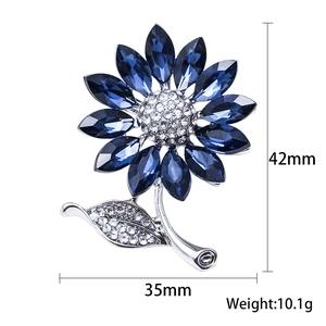 Elegant silver sunflower brooch with dark blue crystal petals and white rhinestone details