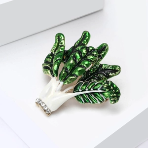 Elegant Chinese cabbage brooch with green enamel and sparkling rhinestones on white base