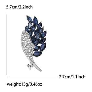 Broche élégante en alliage en forme d'aile avec pierres bleues pour tailleurs femme