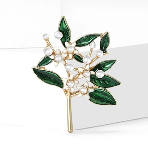 Elegant floral brooch with green enamel leaves and white pearls on golden base