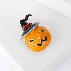 Vibrant orange pumpkin brooch with a black wizard hat and sparkling zircon stones
