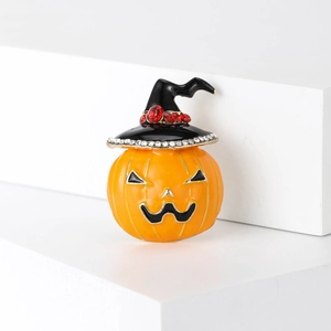Creative Halloween pumpkin brooch with wizard hat and rhinestones on a white stand