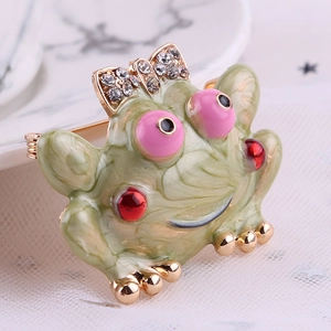 Green marble enamel frog brooch with rhinestone bow tie in a gold-plated setting