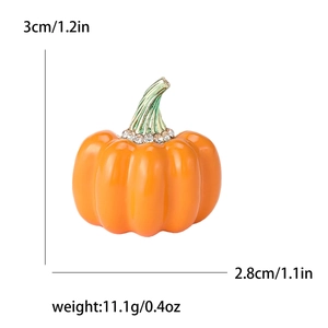 Vibrant orange enamel pumpkin brooch with green stem and sparkling rhinestones for Halloween
