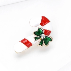 Christmas candy cane brooch in red and white enamel with green rhinestone bow