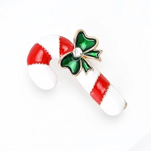 Christmas candy cane brooch with red white stripes and green bow with rhinestone