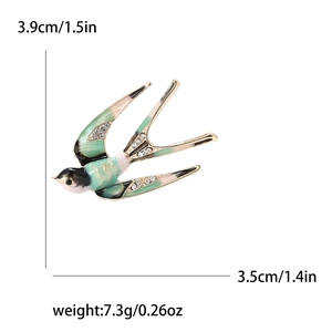 Broche hirondelle exquise avec émail vert et strass pour les costumes de femmes