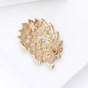 Macro view of the golden hedgehog brooch back showing secure pin and bubble texture