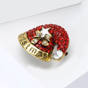 Broche bonnet de Noël en strass rouges scintillants avec détails dorés et étoiles