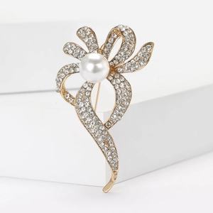 Élégante broche en alliage doré avec nœud en ruban, strass blancs et perle pour femmes