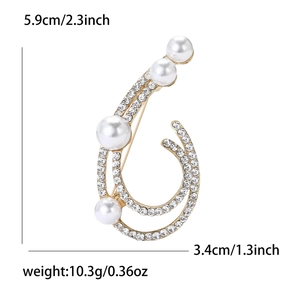 Elegant gold alloy pearl brooch with rhinestones and curved design, 5.9cm x 3.4cm size
