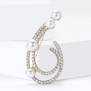 Elegant gold-tone openwork brooch featuring white pearls and sparkling cubic zirconia crystals