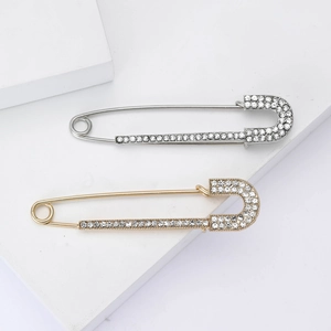 Spille da balia eleganti in oro e argento impreziosite da strass brillanti e raffinati
