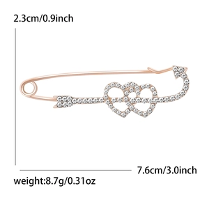 Spilla da balia in oro rosa con cuori di strass scintillanti e design con freccia di Cupido