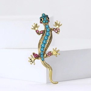 Spilla lucertola dorata vintage con strass blu e rosa su pietra geometrica bianca