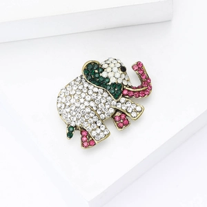 Fashionable elephant brooch with colorful rhinestones on a white geometric stand