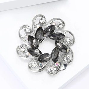 Exquisite flower brooch with dark grey marquise crystals and sparkling white rhinestones