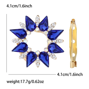 Detail view of sunflower brooch showing 4.1cm size, blue gemstones and pin mechanism