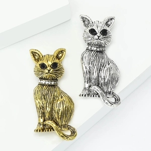 Vintage cat brooches set in antique gold and silver with sparkling rhinestones