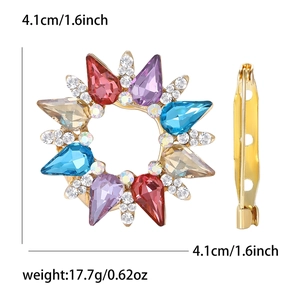 Golden rhinestone crystal brooch with colorful stones and teardrop gems in front and side views