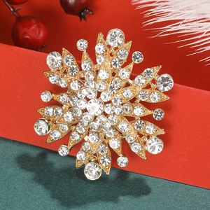 Elegant snowflake brooch with sparkling rhinestones in a festive Christmas themed setting