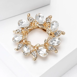 Macro view of crystal flower brooch with gold plating and teardrop waterdrop stones