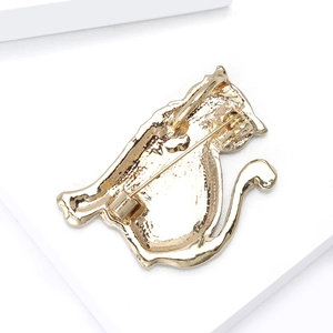Detailed back view of a golden cat brooch showing the secure horizontal safety pin clasp
