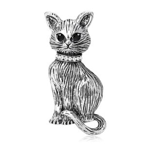 Vintage silver cat brooch with black gemstone eyes and rhinestone collar detailing