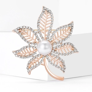 Elegant maple leaf brooch in rose gold with a large white pearl and sparkling crystals